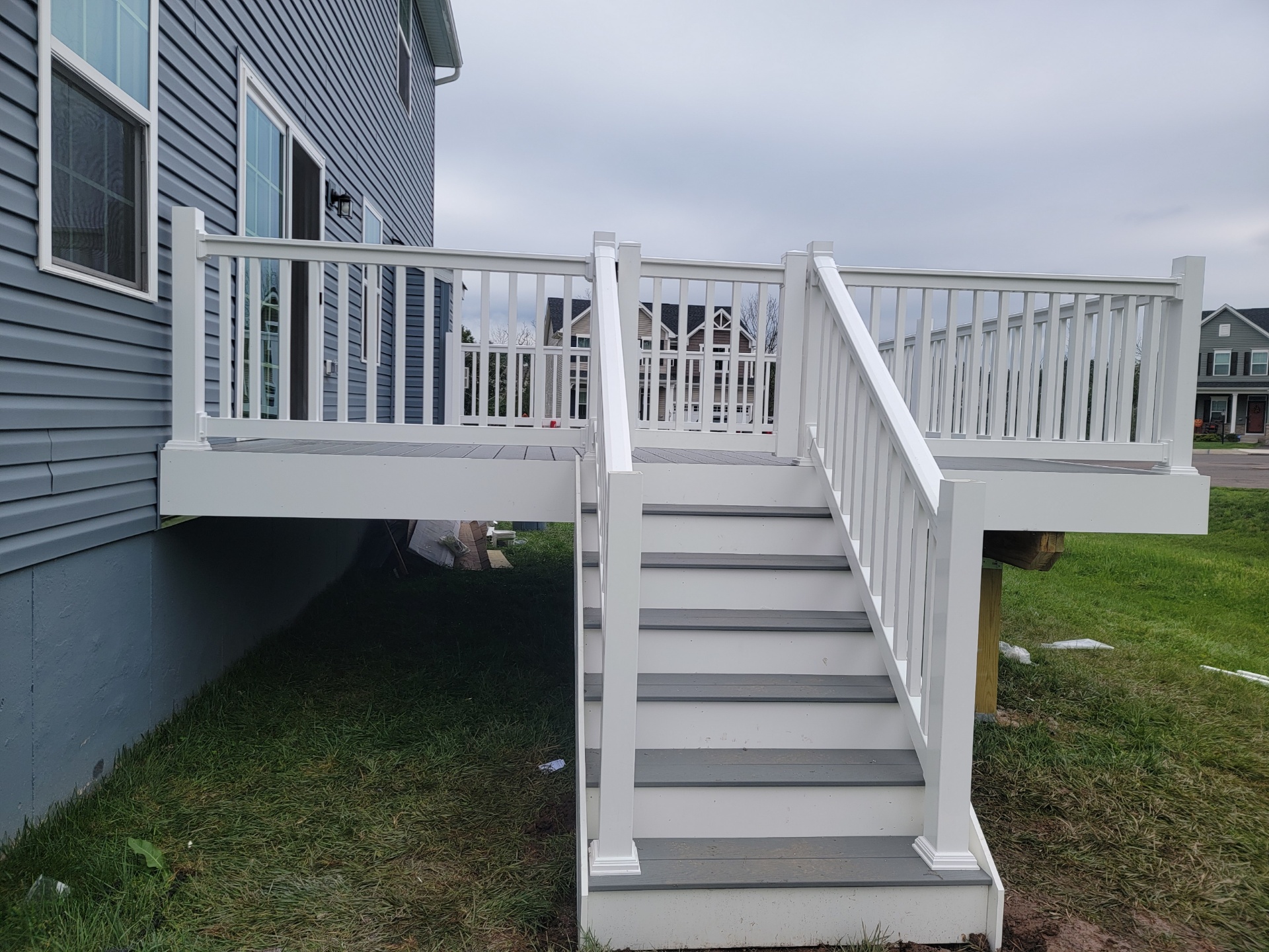 after of a grey vinyl deck being built
