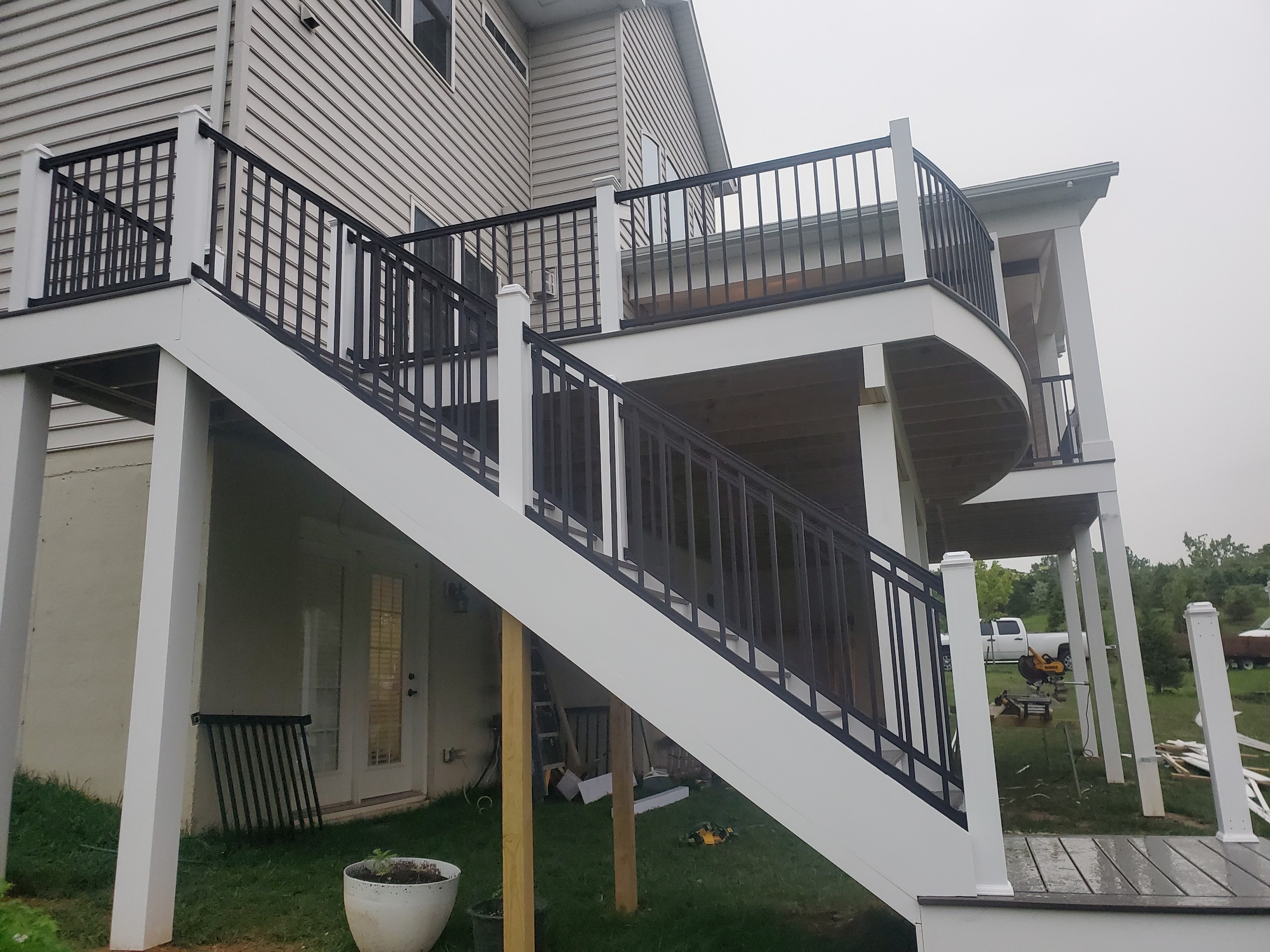 on a rainy day finishing up a deck installation