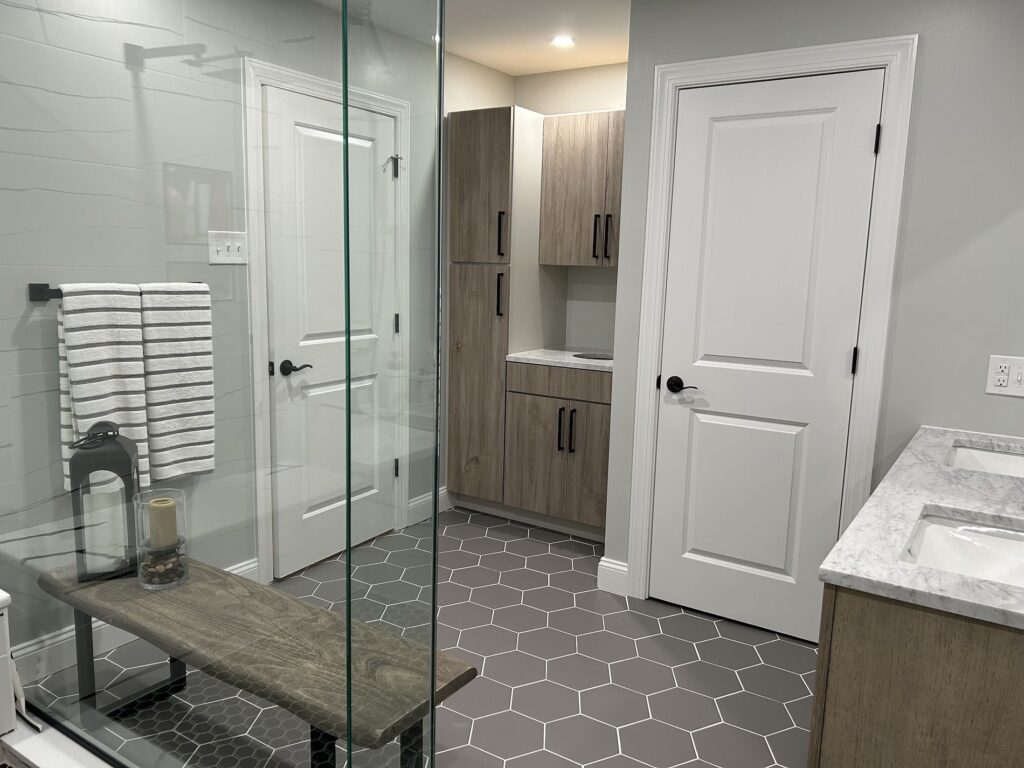 bathroom remodel showcasing the cabinets and the shower work
