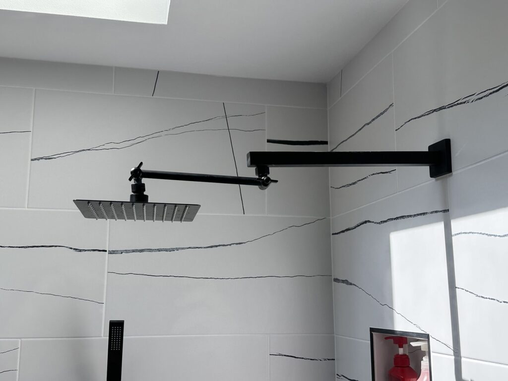 black shower fixture installation