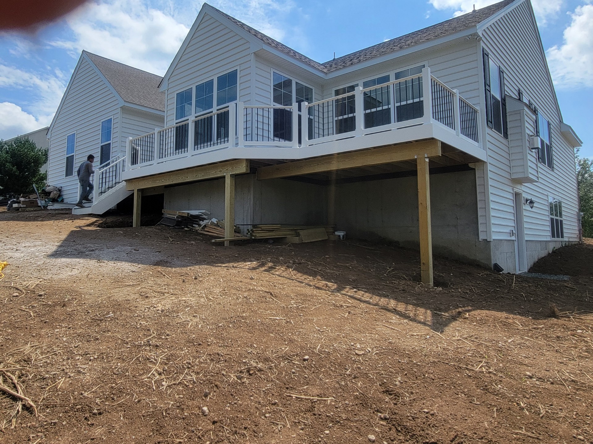 after of the new deck being built with white railings