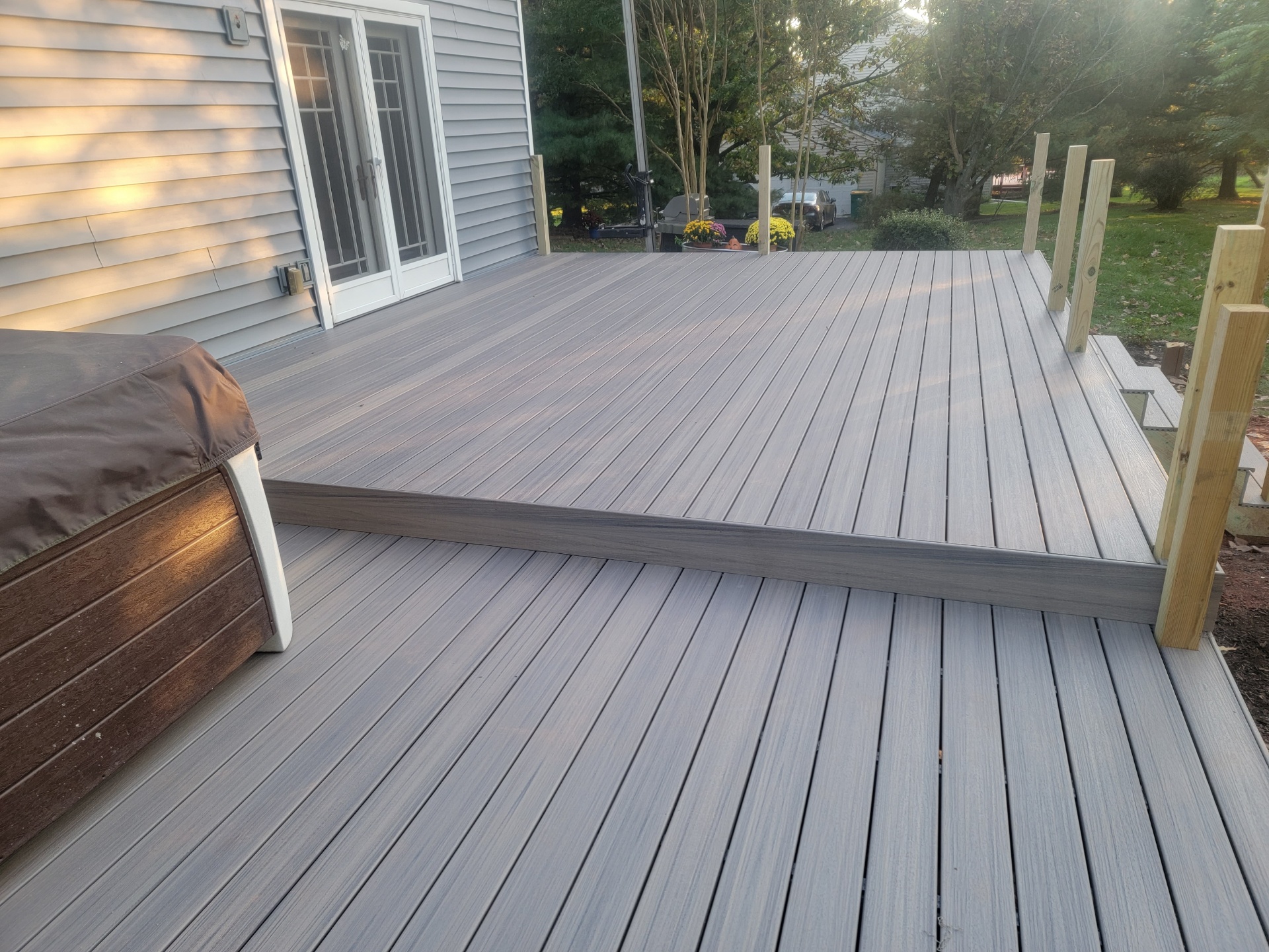 after of a new grey deck build for jacuzzi