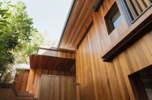 A modern-style home with wood siding.