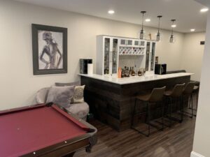 basement remodel with bar and pool table