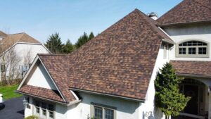 residential roofing services at a home with brown roofing shingles