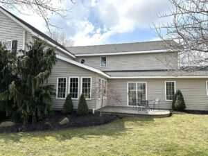 exterior siding services in the back of a residential home