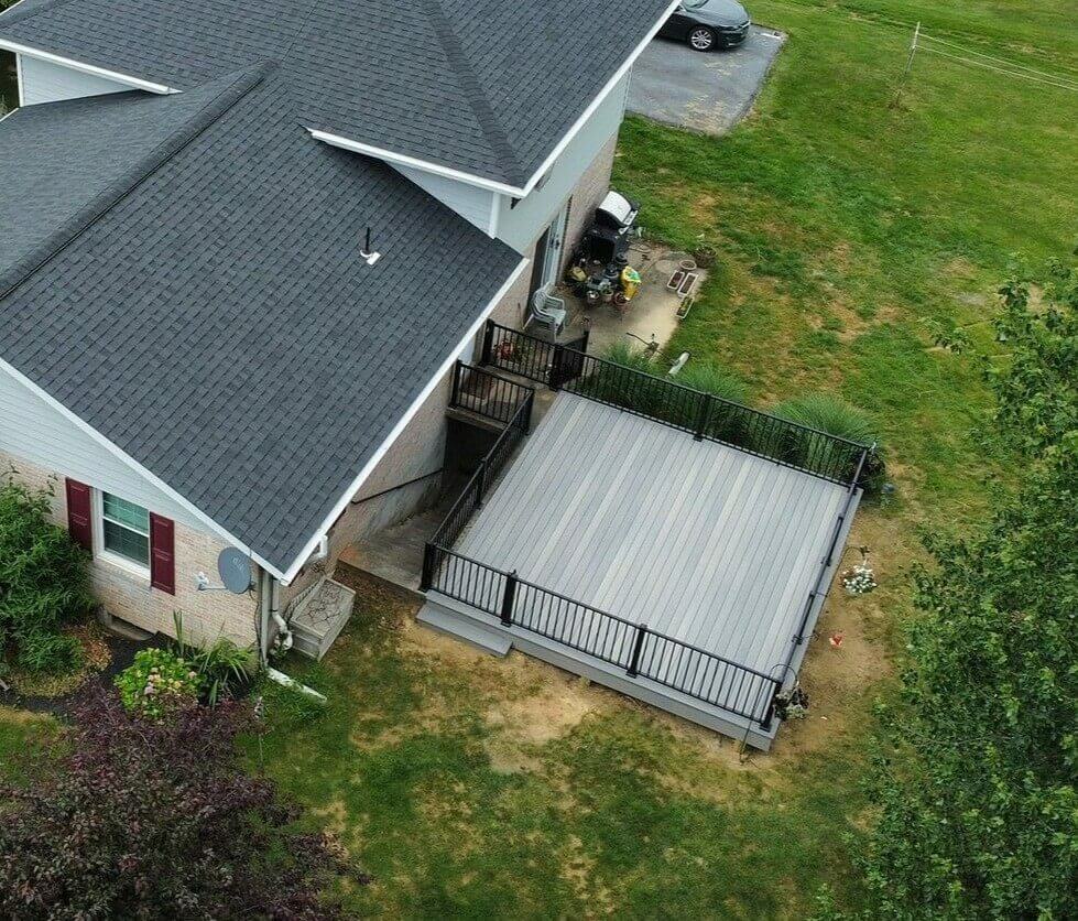 An aerial shot of a deck extension on a ranch house