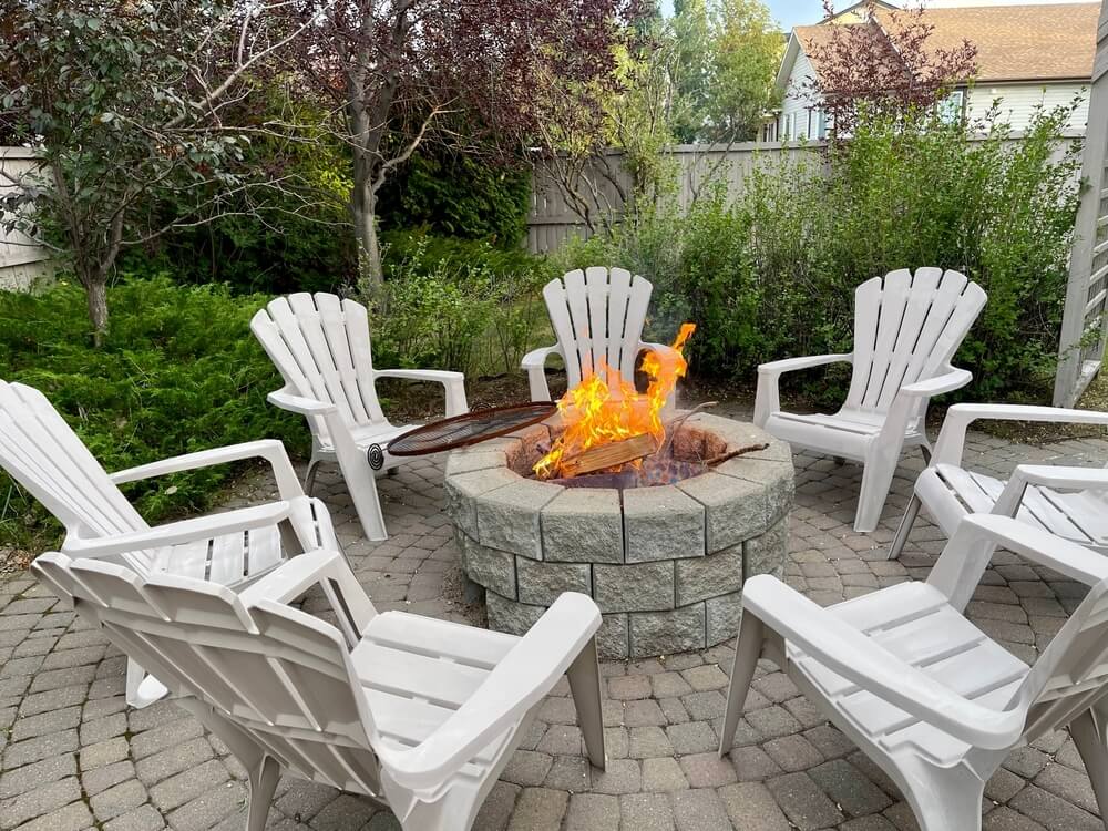 An outdoor fire pit built with pavers