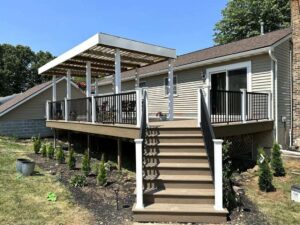 A wooden deck with a pergola for shade
