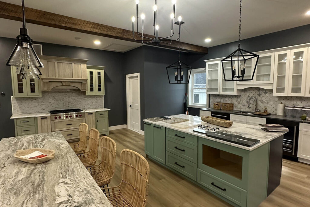 A commercial remodeling example with a kitchen counter and island next to a table with four chairs.