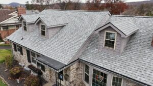 New roof from a residential roofing contractor on a stone home