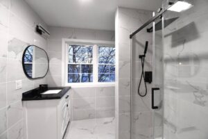 Bathroom remodel with while tiled floor and walls