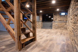 Basement with wood floors and stone walls