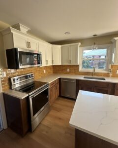 Kitchen remodel with yellow tile backsplash and wooden floors
