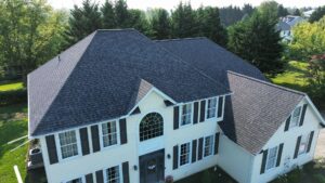 New resdiential roof on a large yellow house