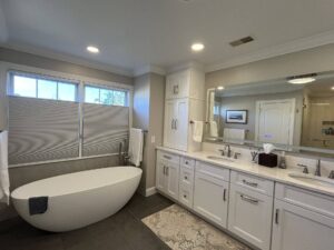 Completed bathroom remodel from general contractors in Bucks County, PA showing a new tub, sink, floors, and more.
