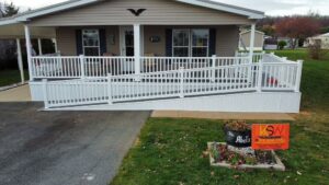 Finished white ramp leading to a porch for a house in York County, PA
