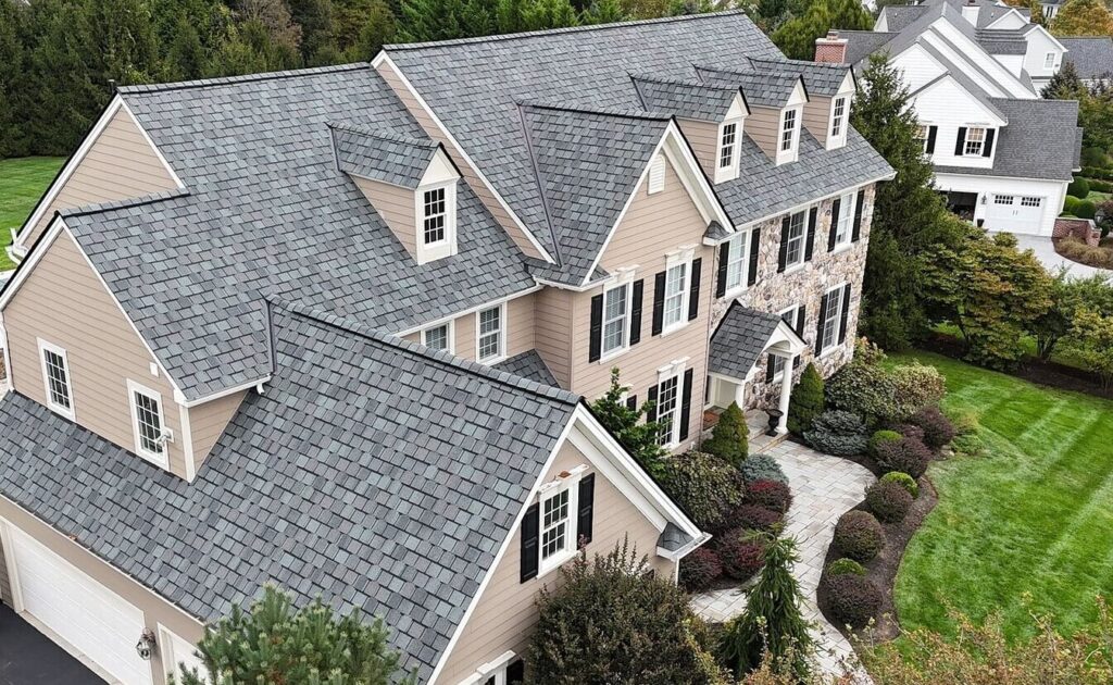 A house after their residential roof replacement in Chester Springs with gray shingles, taken at a side angle